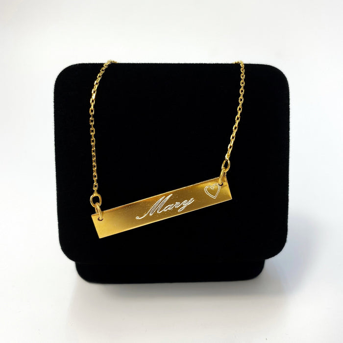 14K Yellow Gold Name Bar Necklace with Heart. Kays jewelery, jewelery store, jewelery store near me, jewelery near me, jareds jewelery, jareds jewelery, jewelery sale, nameplate necklace, bar pendant with name, bar pendant with name, name necklace, gold chains for men, gold chains, mens necklaces, nameplate necklace, jewelery store in Brooklyn.